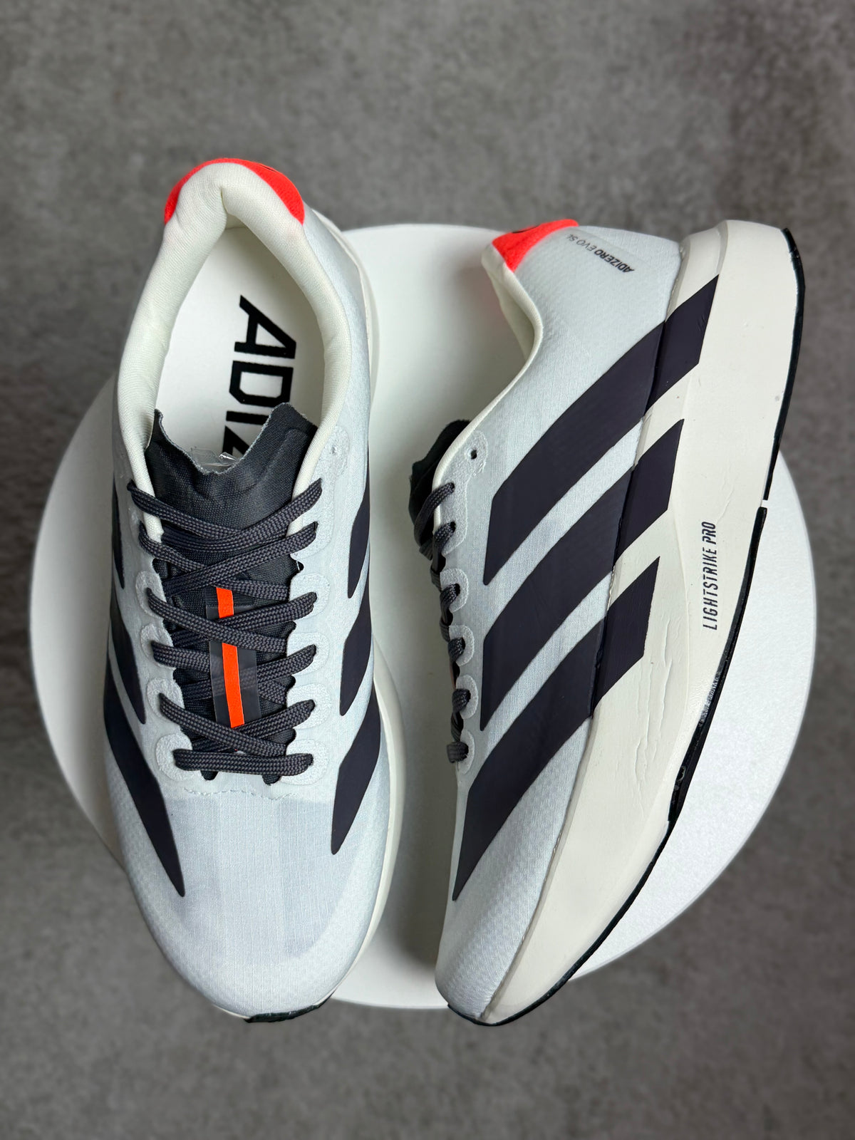 Tênis Adizero Evo - Branco/Preto/Laranja - Edição Especial